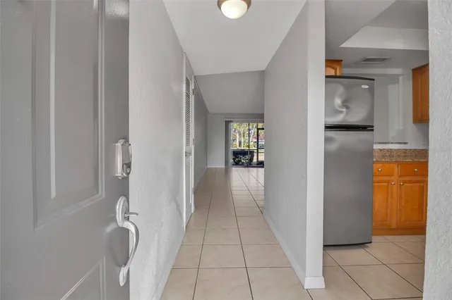 a view of a hallway with a furniture and a livingroom