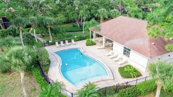 an aerial view of a house with outdoor space and street view