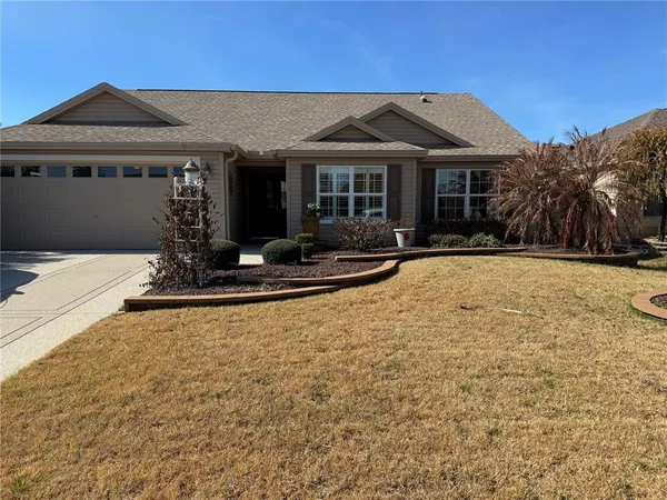 a front view of a house with yard outdoor seating and barbeque oven