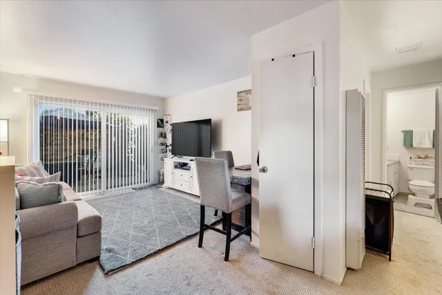 a livingroom with a couch and a flat screen tv