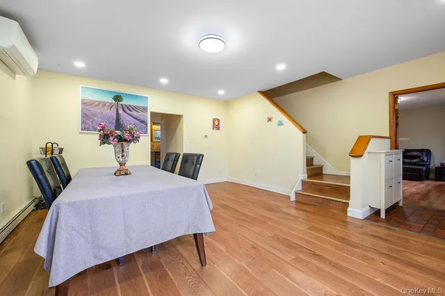 a bed room with a bed and a view of kitchen