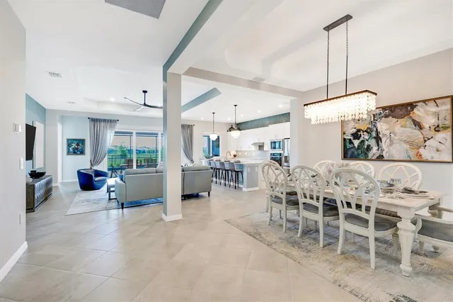 a bathroom with a tub double sink window and mirror