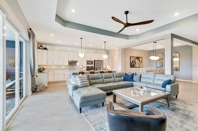 a bathroom with a tub a sink and a large mirror