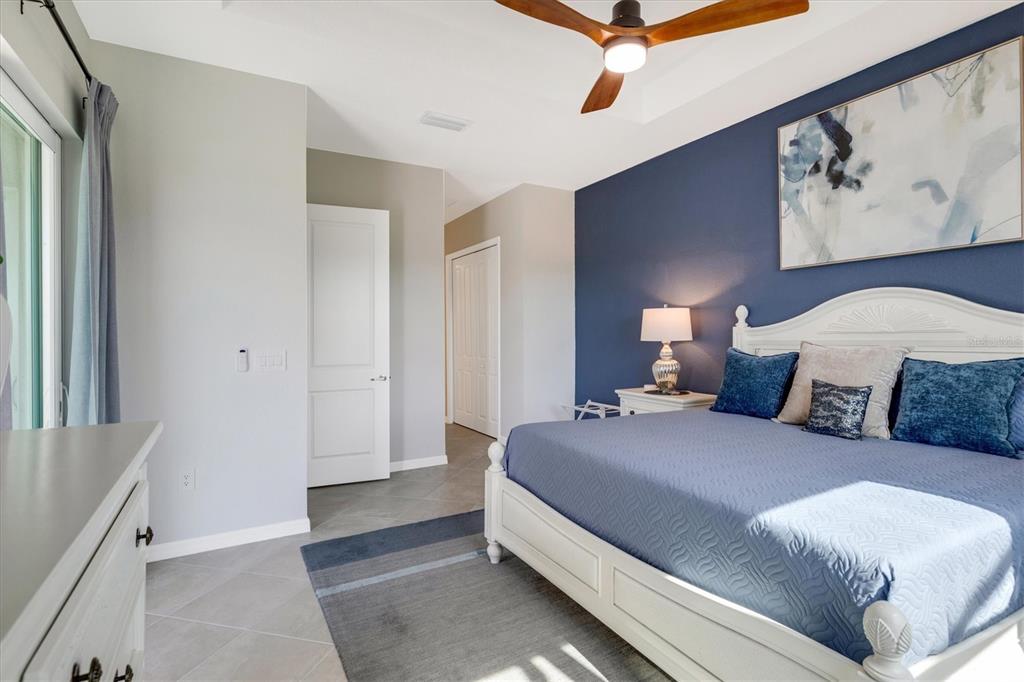 12736 Tulum Loop Venice, FL 34293 - Photo 31 of 93 a bedroom with a bed and a window