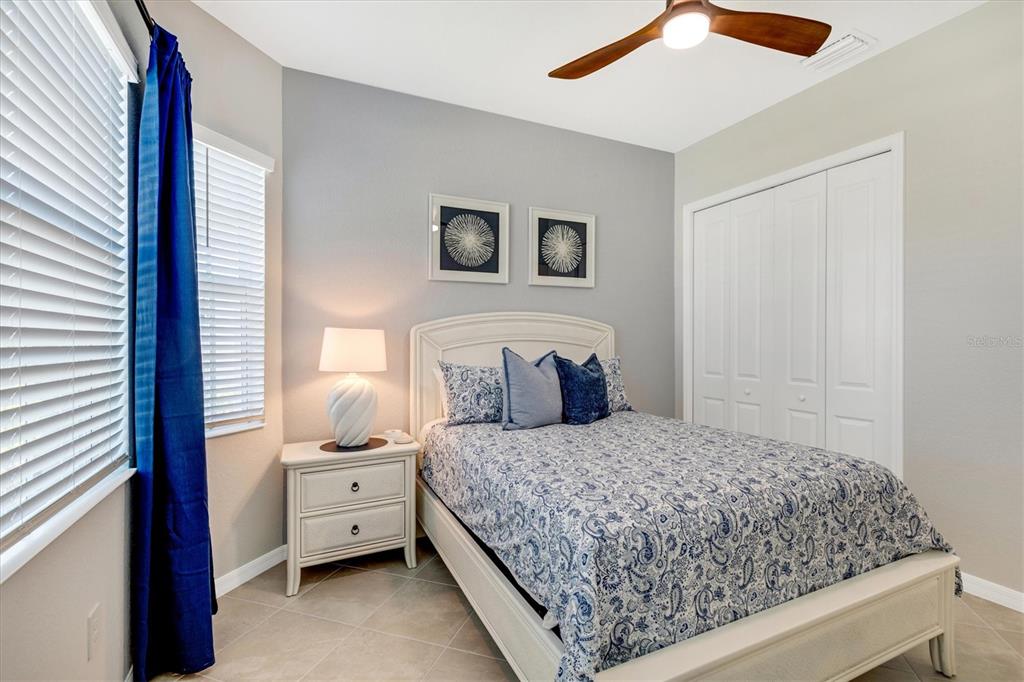 12736 Tulum Loop Venice, FL 34293 - Photo 37 of 93 a bedroom with a bed and a window