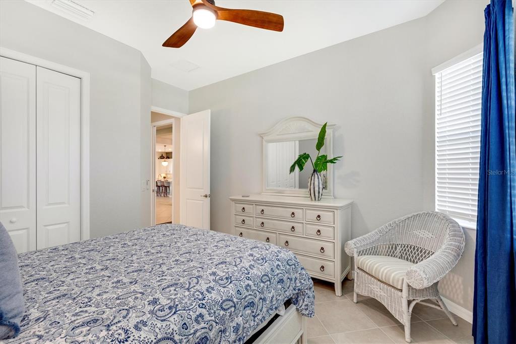 12736 Tulum Loop Venice, FL 34293 - Photo 38 of 93 a bedroom with a bed and a dresser