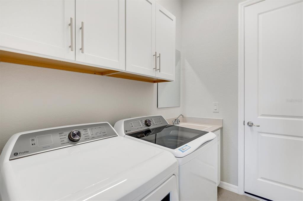 12736 Tulum Loop Venice, FL 34293 - Photo 42 of 93 a utility room with dryer and washer