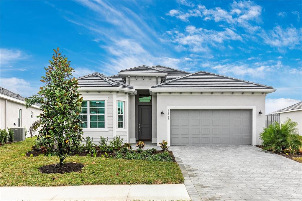 12736 Tulum Loop Venice, FL 34293 - Photo 43 of 93 front view of a house with a yard