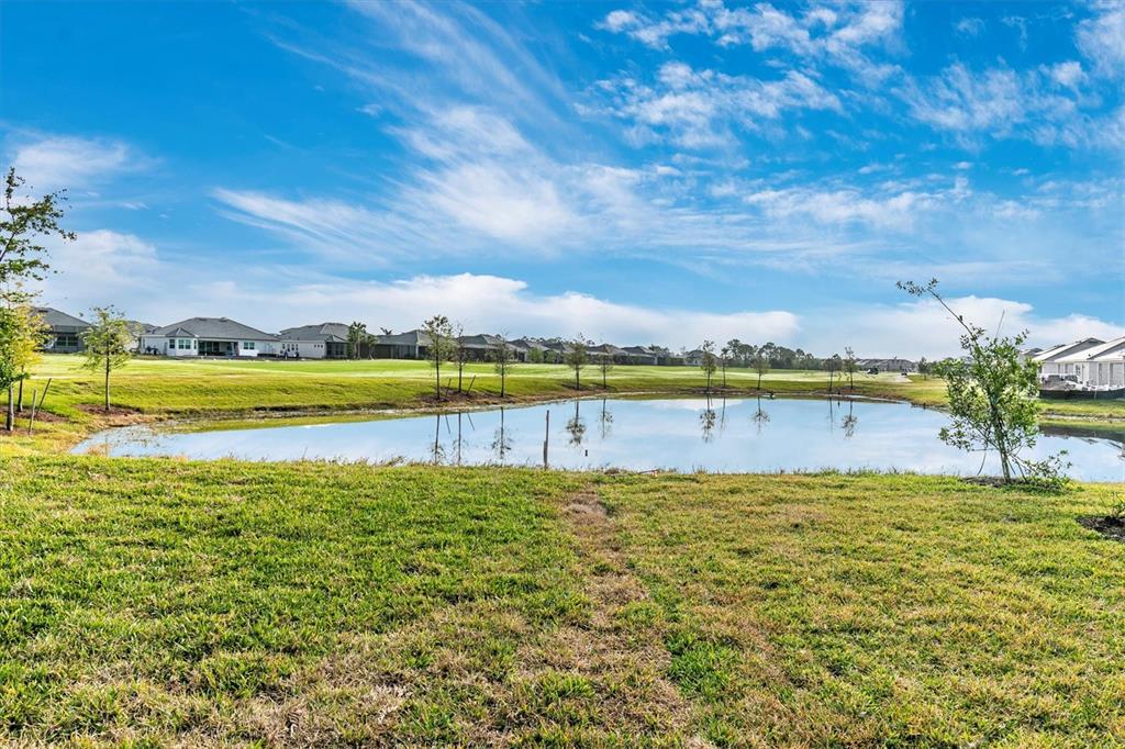12736 Tulum Loop Venice, FL 34293 - Photo 46 of 93 a view of a lake with houses in the back