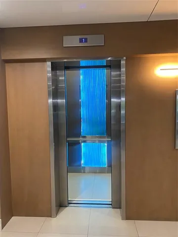 a kitchen with stainless steel appliances a refrigerator and a cabinets