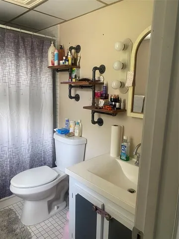 a bathroom with a toilet and a sink