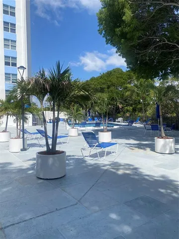 a view of outdoor space with seating area and trees