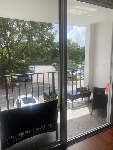 a view of a glass door with a balcony