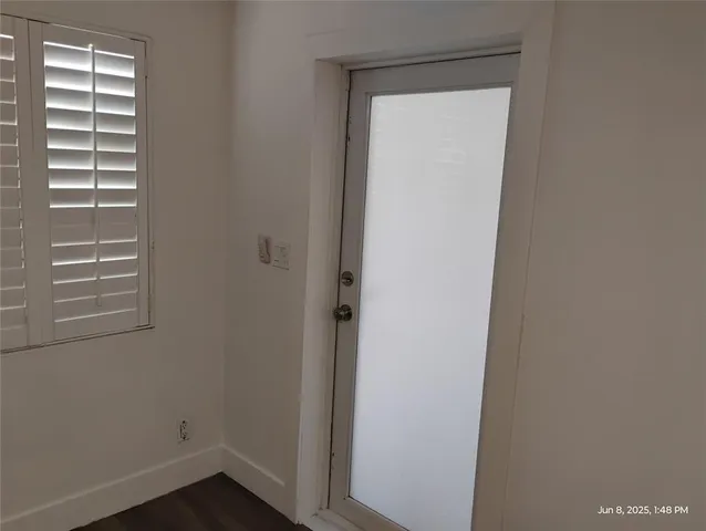a kitchen with stainless steel appliances a microwave a stove and a refrigerator