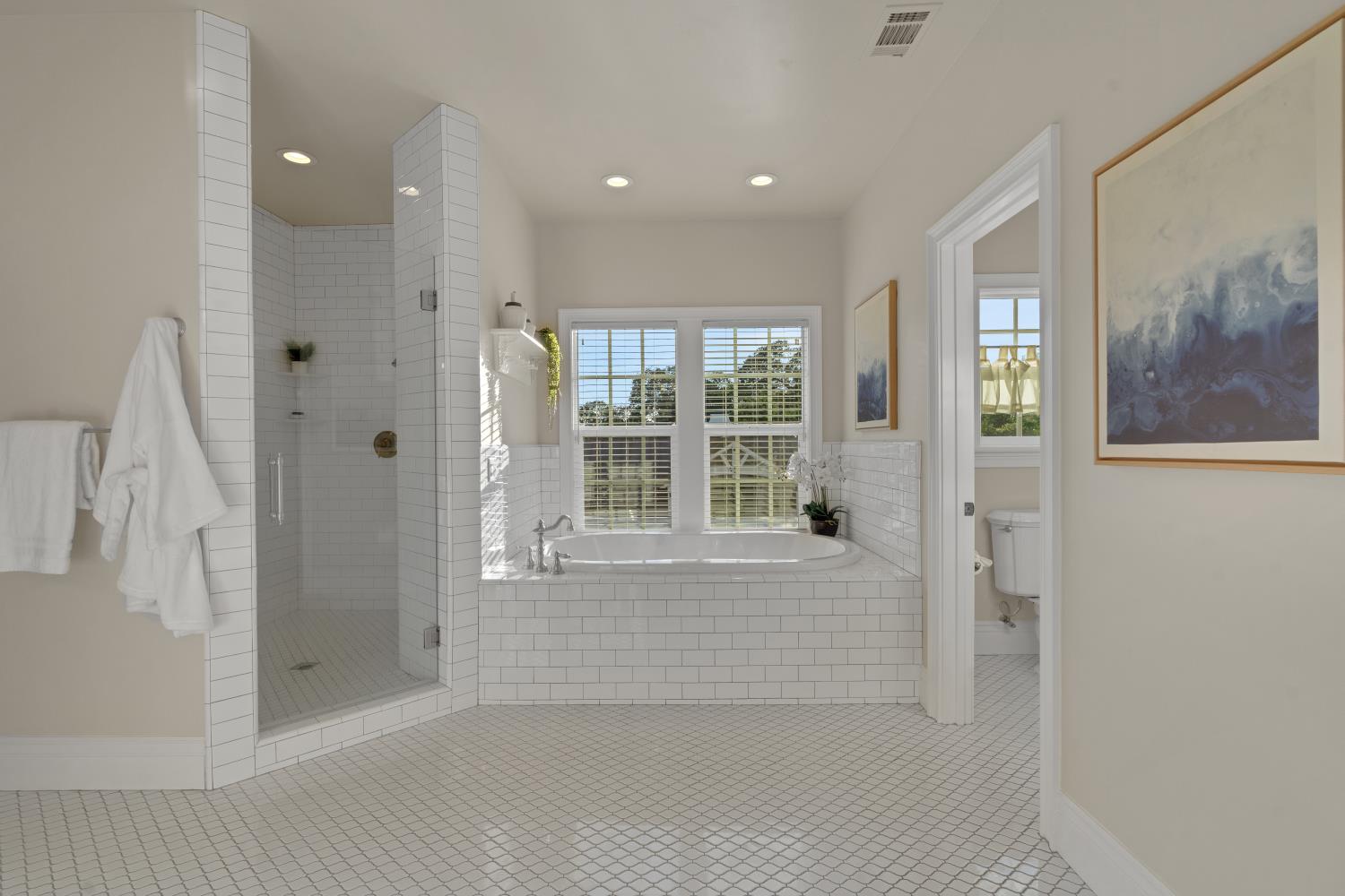 2905 Virginiatown Road Lincoln, CA 95648 - Photo 29 of 86 Primary Bathroom-Spacious bathroom featuring a built-in soaking tub, a separate glass-enclosed shower, white subway tile accents, and a white mosaic floor