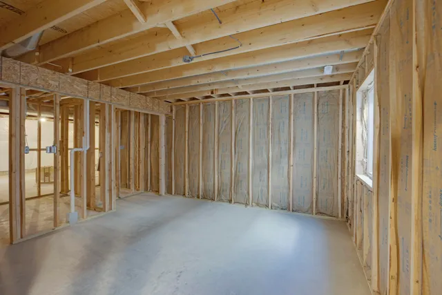 a view of an empty room with wooden walls