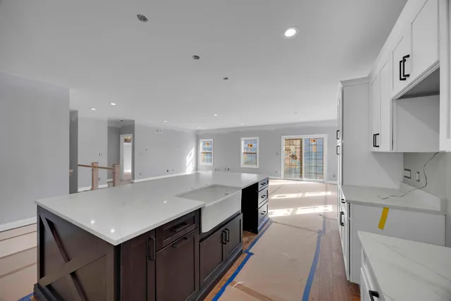 a kitchen with a stove a sink and a refrigerator