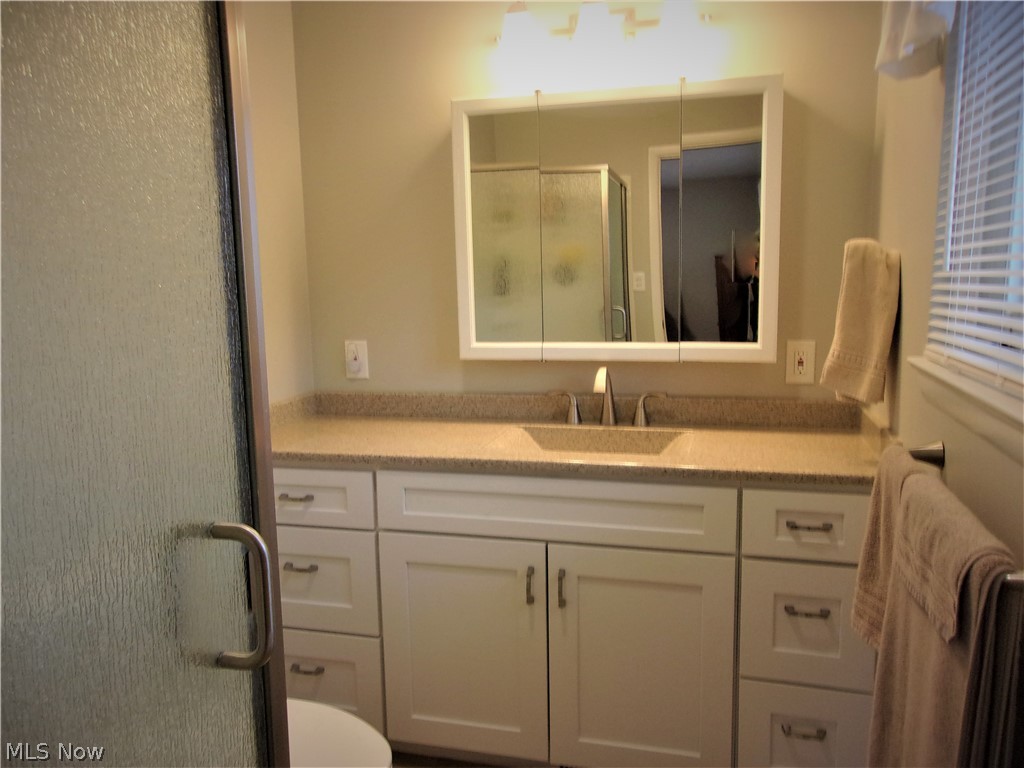 546 Spring Pond Road Northfield, OH 44067 - Photo 12 of 20 Updated master bath with new flooring, counter top and shower doors
