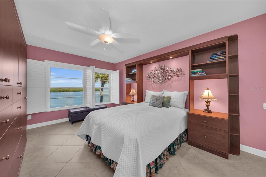 4420 Exeter Drive, Unit 307 Longboat Key, FL 34228 - Photo 12 of 37 a bedroom with a bed and window