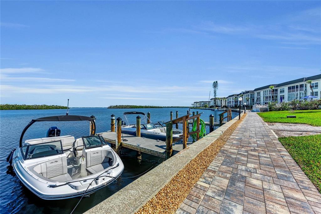 4420 Exeter Drive, Unit 307 Longboat Key, FL 34228 - Photo 22 of 37 a view of swimming pool with lounge chair
