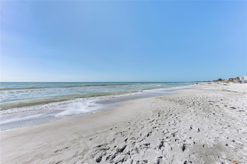 4420 Exeter Drive, Unit 307 Longboat Key, FL 34228 - Photo 26 of 37 a view of beach and an ocean view