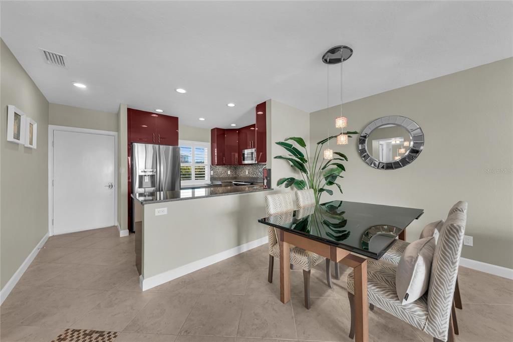 4420 Exeter Drive, Unit 307 Longboat Key, FL 34228 - Photo 6 of 37 a view of kitchen with dining area