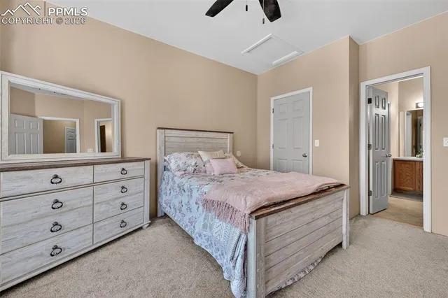 a bedroom with a bed and a dresser