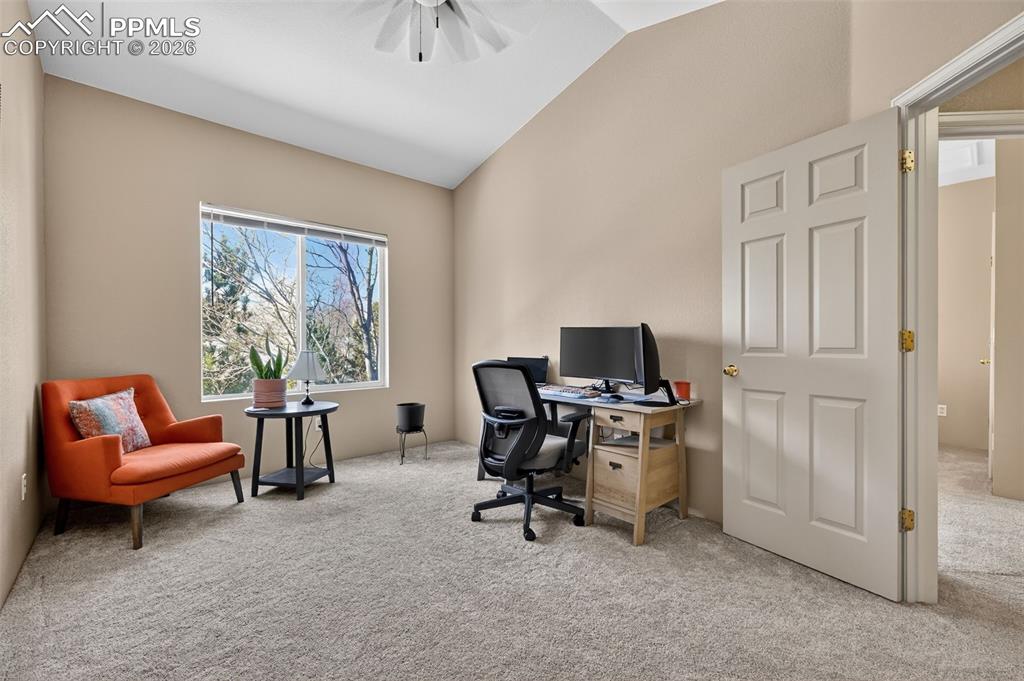2141 Legacy Ridge View, Unit 109 Colorado Springs, CO 80910 - Photo 15 of 21 a view of a workspace with a window and chair