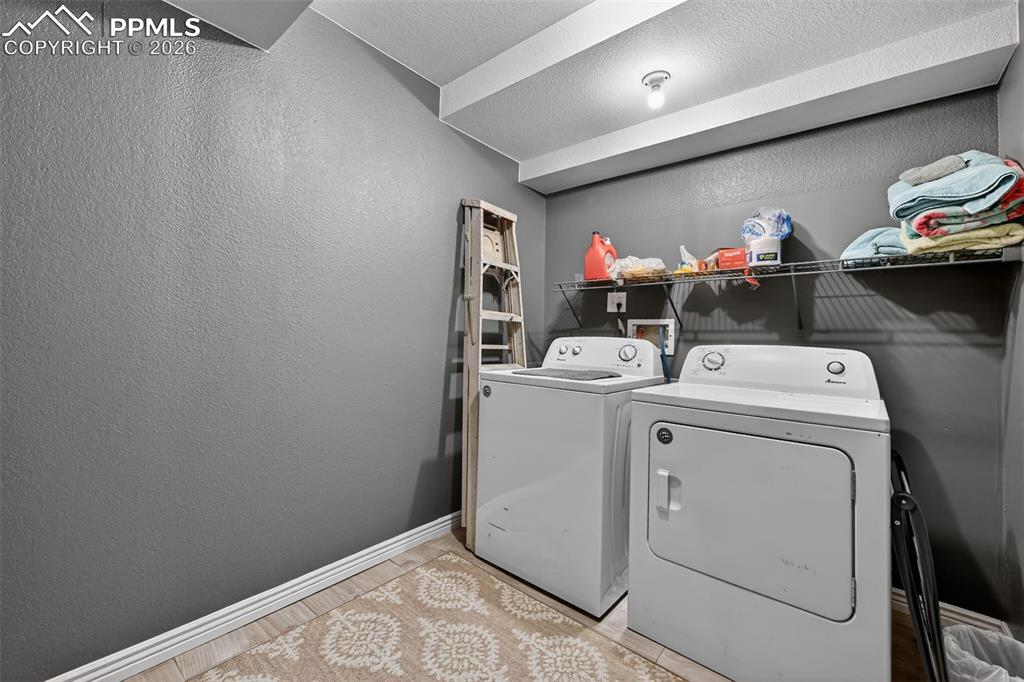 2141 Legacy Ridge View, Unit 109 Colorado Springs, CO 80910 - Photo 20 of 21 a room with storage and utility