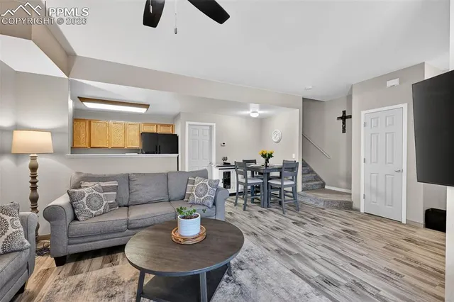 a living room with furniture and a flat screen tv