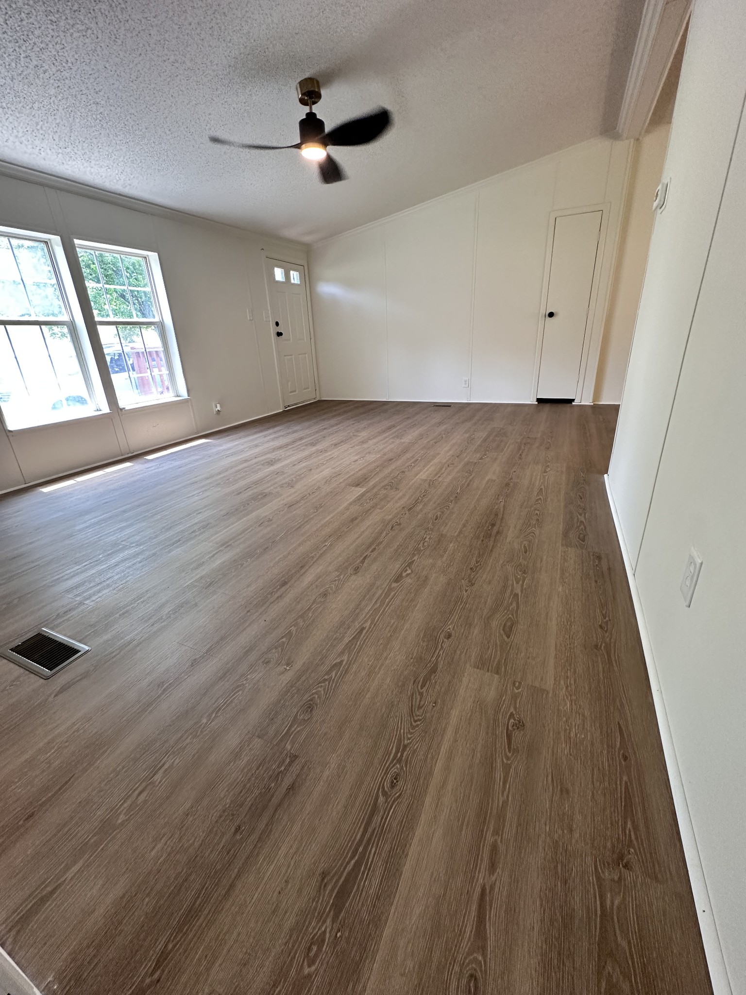7287 Pinewood Road Nunnelly, TN 37137 - Photo 15 of 18 wooden floor in an empty room with a window