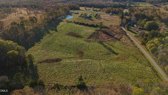 a aerial view of a house with a yard