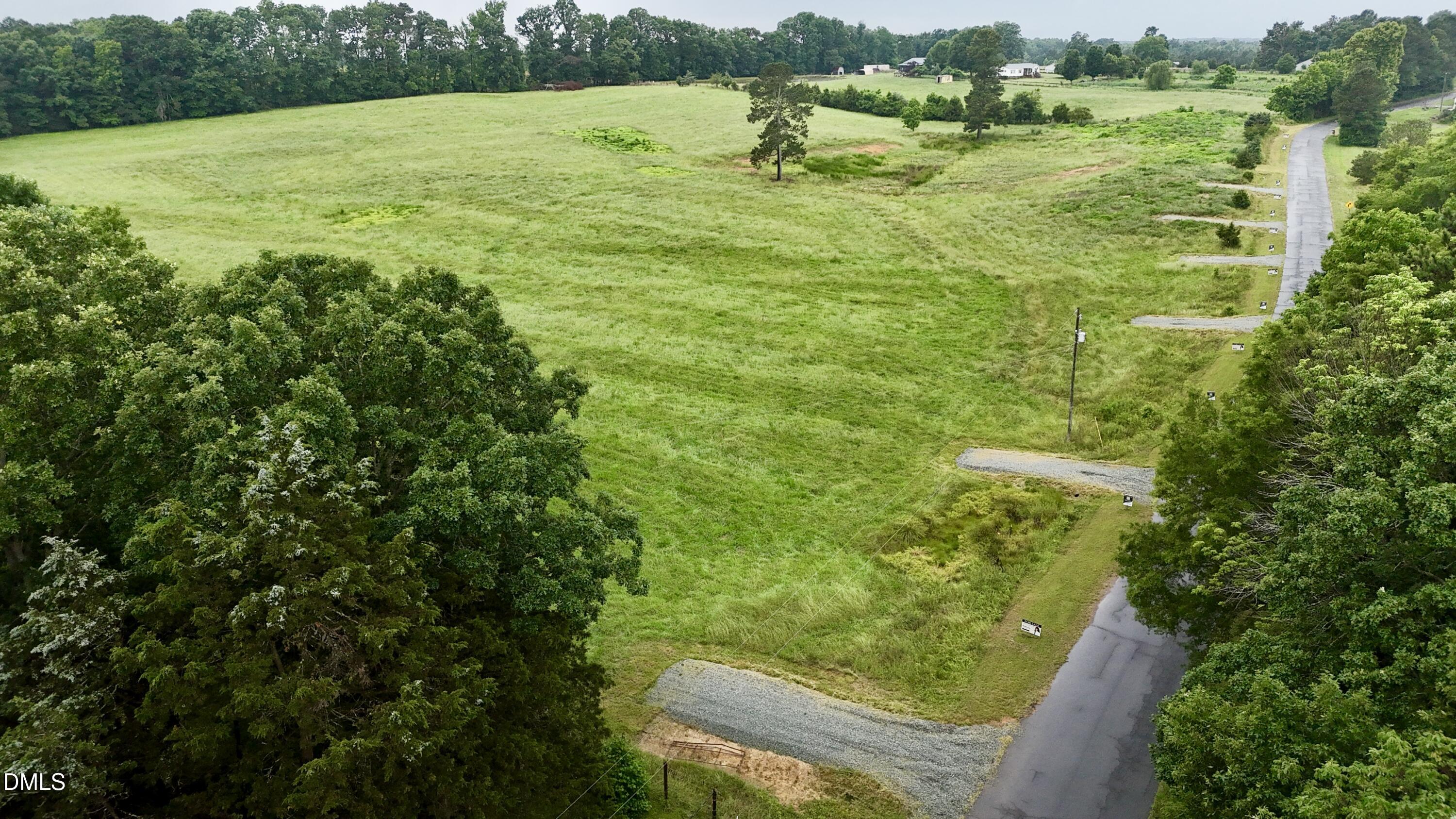 321 Gilliland Road Siler City, NC 27344 - Photo 13 of 15 a view of a green yard with an outdoor seating and mountain view