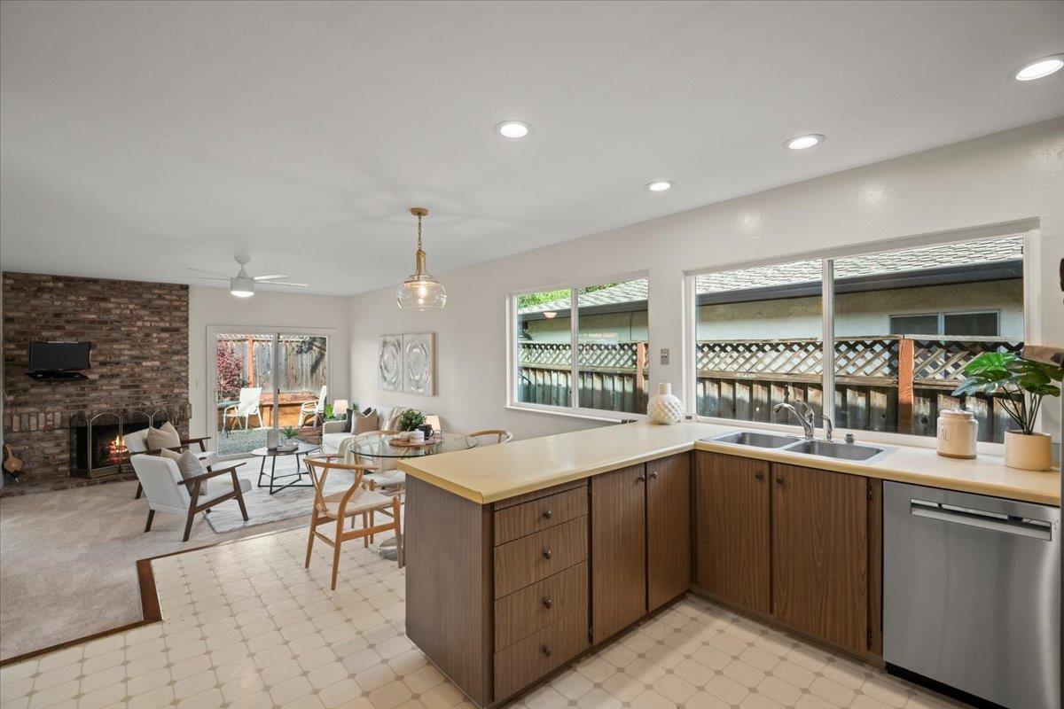 663 Smoke Tree Way Sunnyvale, CA 94086 - Photo 14 of 29 a kitchen with a sink table and chairs