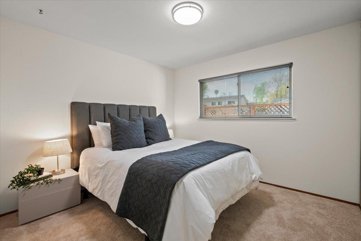 663 Smoke Tree Way Sunnyvale, CA 94086 - Photo 19 of 29 a bedroom with a bed and a painting on the wall