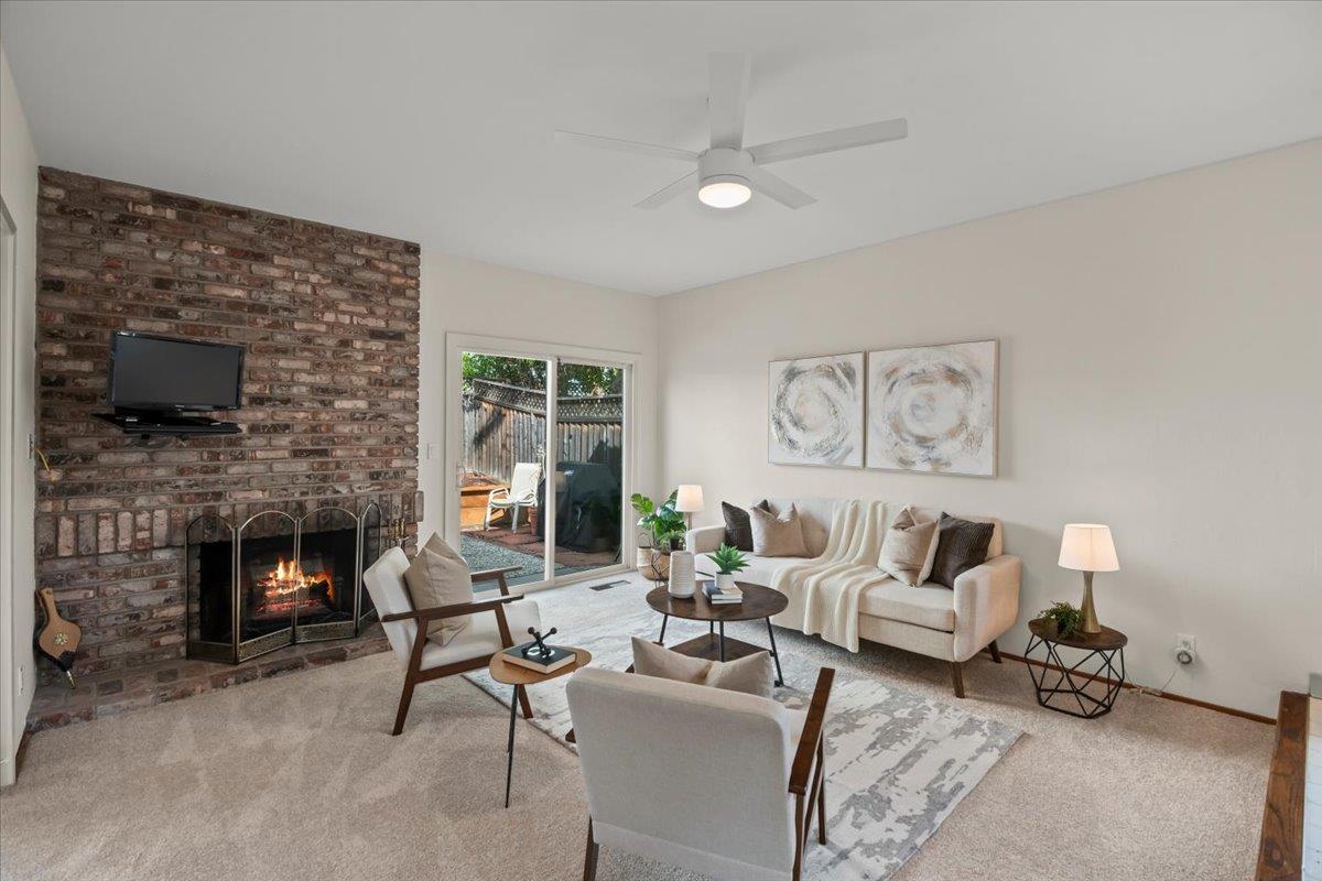 663 Smoke Tree Way Sunnyvale, CA 94086 - Photo 10 of 29 a living room with furniture and a fireplace