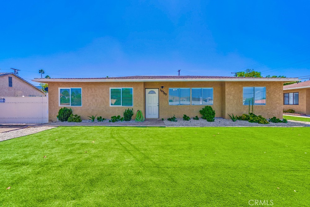 19789 Evelyn Street Corona, CA 92881 - Photo 1 of 22 a front view of house with a garden
