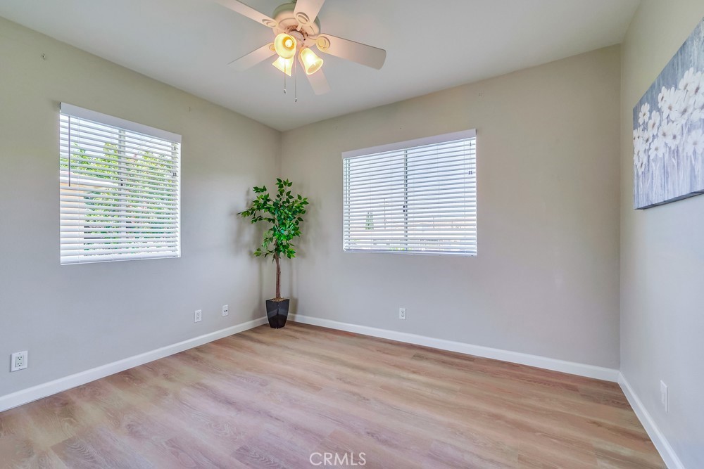 19789 Evelyn Street Corona, CA 92881 - Photo 14 of 22 a view of empty room with wooden floor and fan