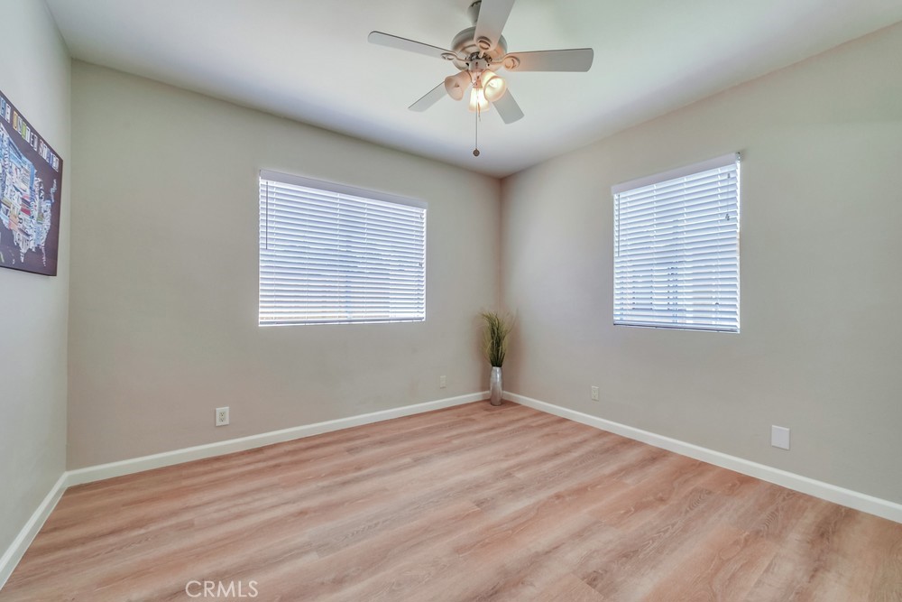 19789 Evelyn Street Corona, CA 92881 - Photo 17 of 22 a view of a room with windows and ceiling fan