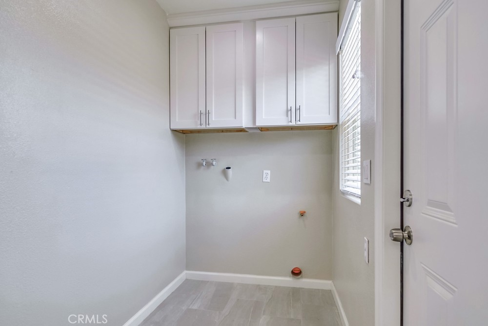 19789 Evelyn Street Corona, CA 92881 - Photo 19 of 22 a view of storage and utility room with wooden floor