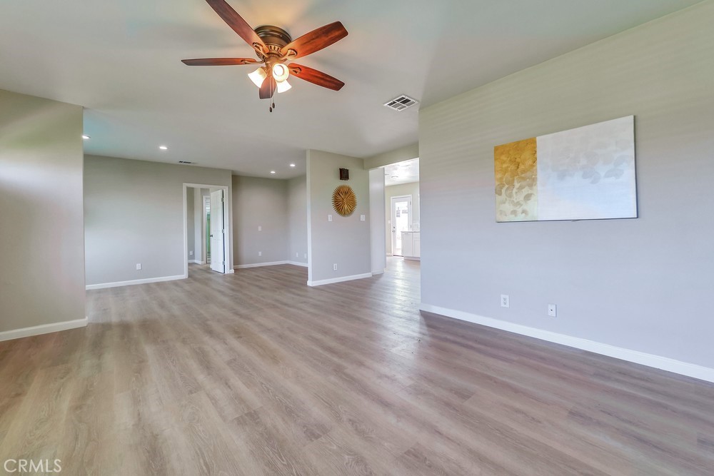19789 Evelyn Street Corona, CA 92881 - Photo 4 of 22 a view of a livingroom with a ceiling fan window and a ceiling fan