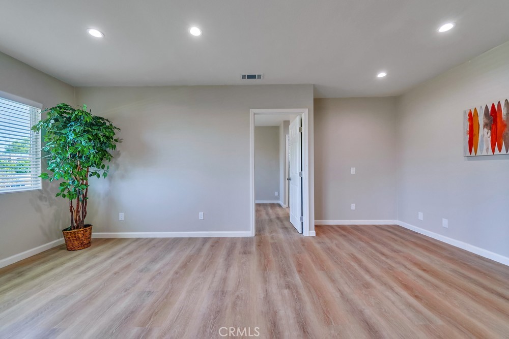 19789 Evelyn Street Corona, CA 92881 - Photo 5 of 22 a view of room with window and wooden floor