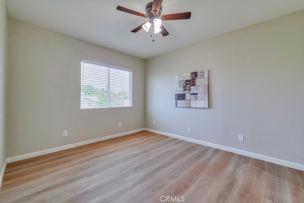19789 Evelyn Street Corona, CA 92881 - Photo 8 of 22 wooden floor in an empty room with a window