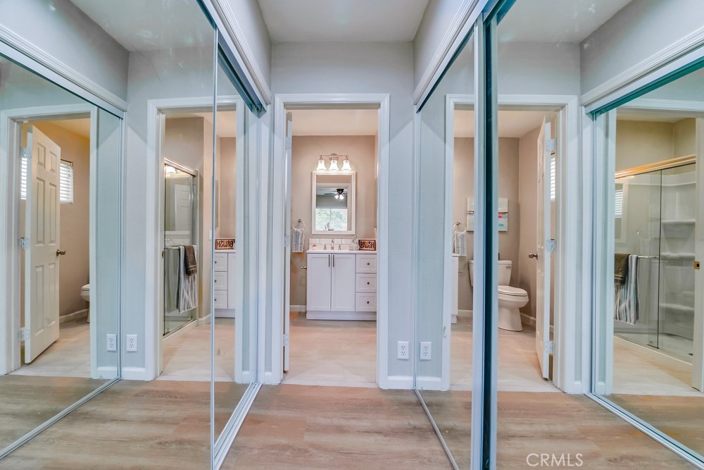 19789 Evelyn Street Corona, CA 92881 - Photo 10 of 22 a view of a hallway with wooden floor and living room