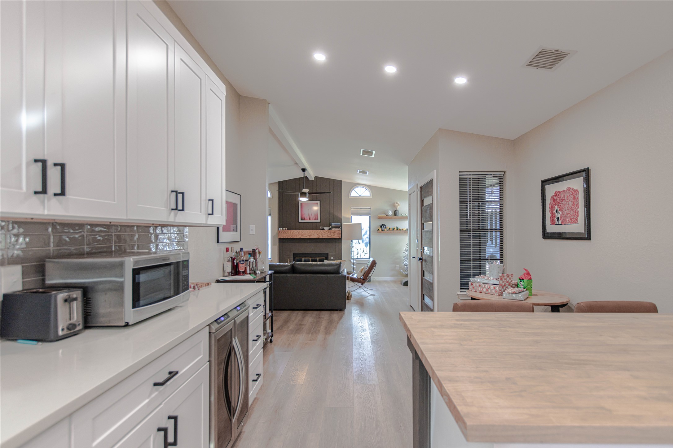 1622 Cattle Trail Austin, TX 78748 - Photo 12 of 22 a large kitchen with stainless steel appliances a large counter top a stove and a wooden floors