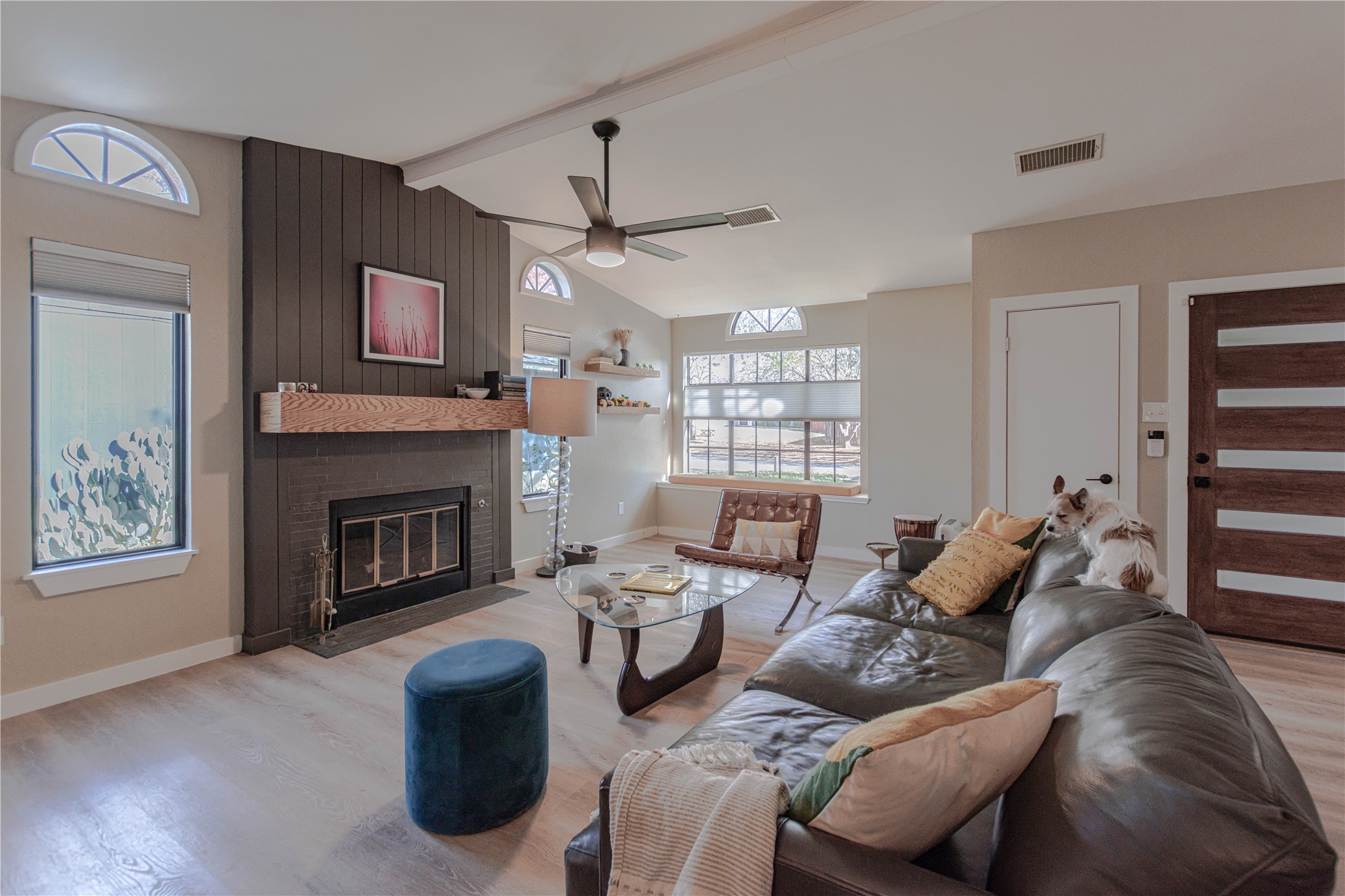 1622 Cattle Trail Austin, TX 78748 - Photo 18 of 22 a living room with furniture fireplace and a flat screen tv
