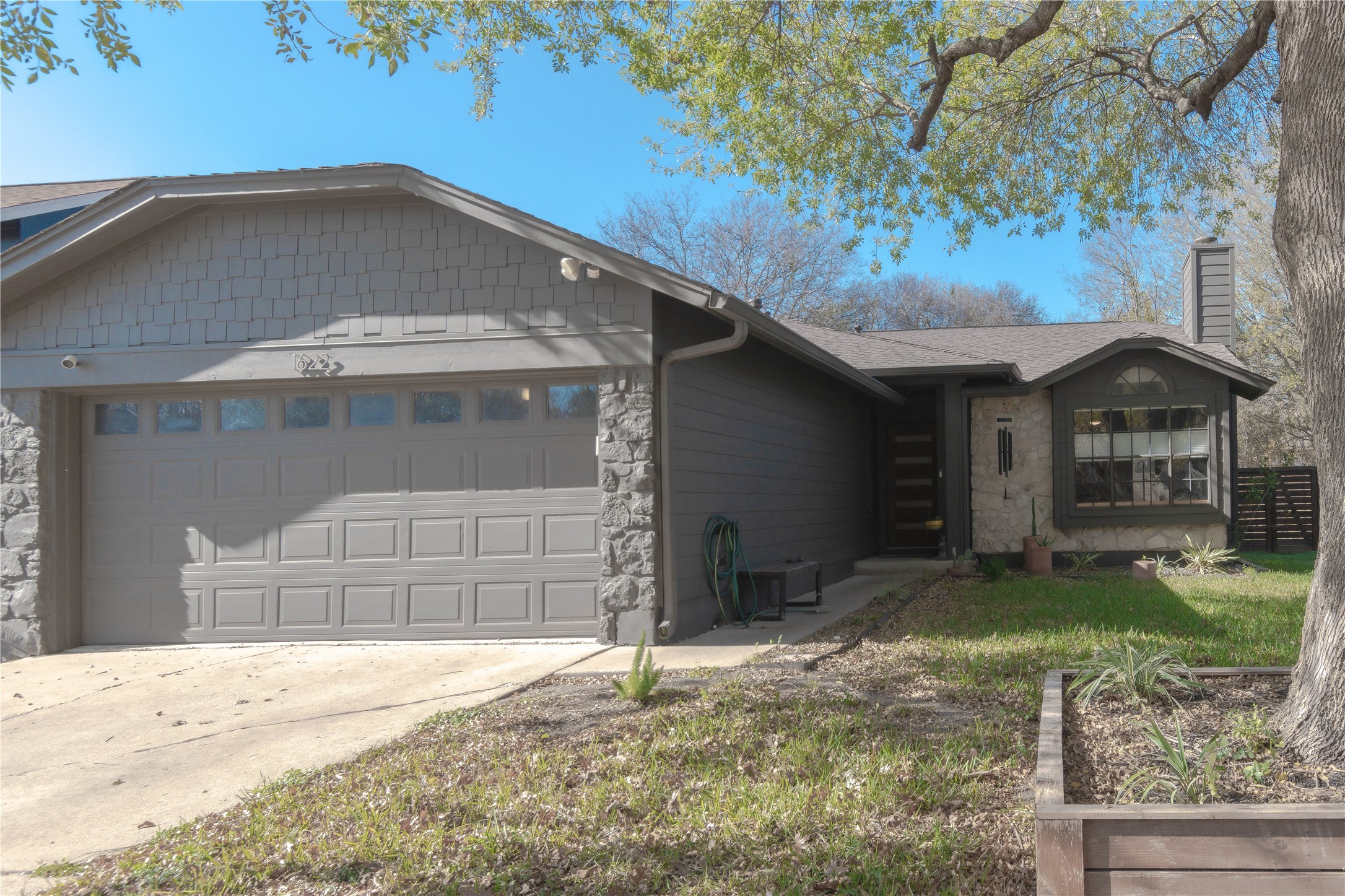 1622 Cattle Trail Austin, TX 78748 - Photo 2 of 22 a front view of a house with a yard
