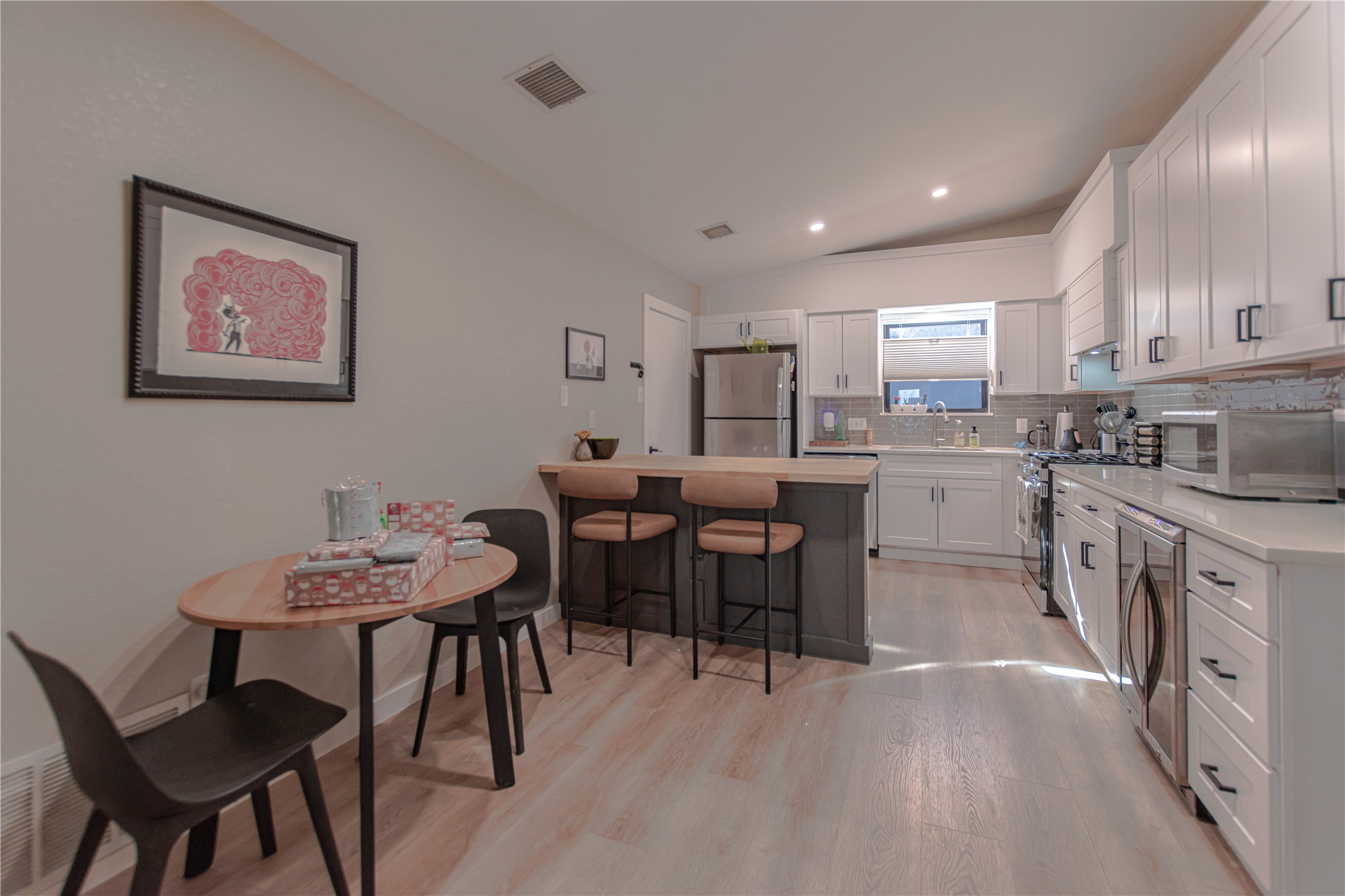 1622 Cattle Trail Austin, TX 78748 - Photo 9 of 22 a view of kitchen with cabinets table and chairs