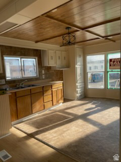 1265 North Corbonville Road, Unit 100 Price, UT 84501 - Photo 2 of 10 Kitchen with wood finish cabinets, wooden ceiling, and light countertops