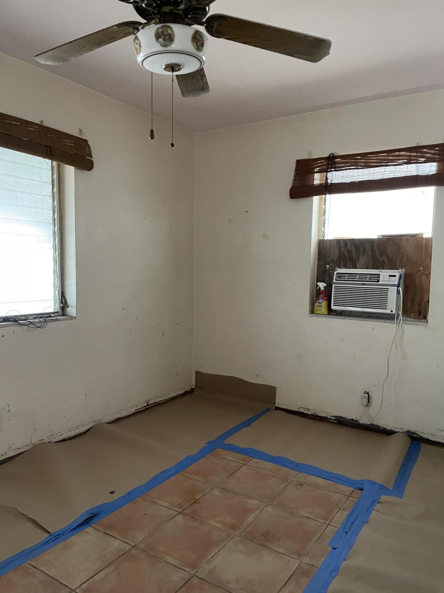 1716 Laird Street Key West, FL 33040 - Photo 21 of 32 a room with a ceiling fan and a wooden floor
